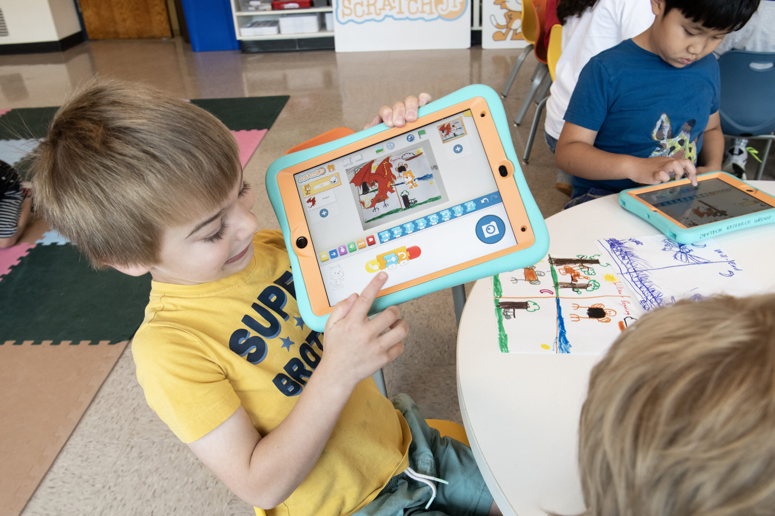 Child playing with Scratchjr