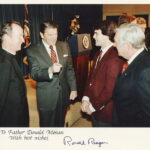 Fr. Donan with Ronald Reagan, Doug Flutie, and Silvio Conte