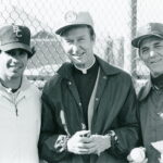 Father Monan with baseball coaches